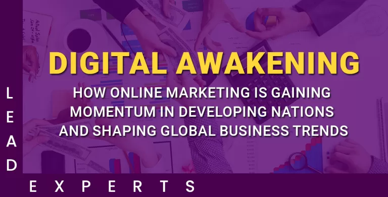 Hands working on laptops and charts with the text “DIGITAL AWAKENING: How online marketing is gaining momentum in developing nations and shaping global business trends.”. - Lead Experts